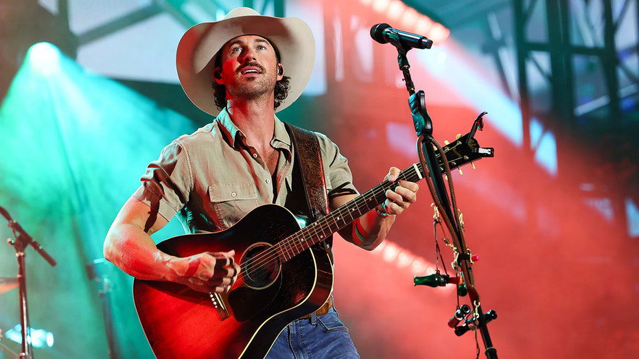 Country star Riley Green's concert takes unexpected turn as woman crashes stage, escorted off by security