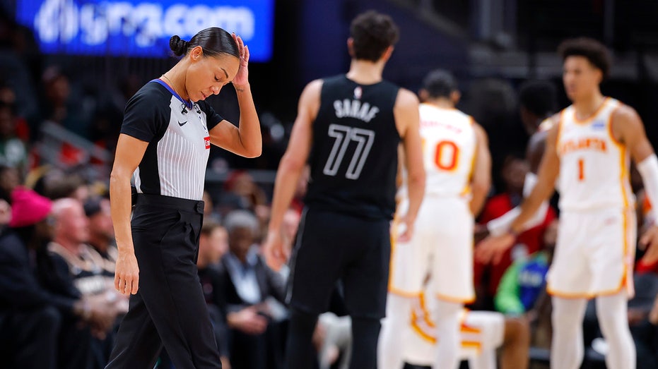 NBA referee goes down hard after brutal collision with camera operator during Hawks-Nets game