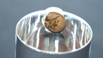 Teen stumbles on mysterious coin from legendary city, puzzling archaeologists over its journey
