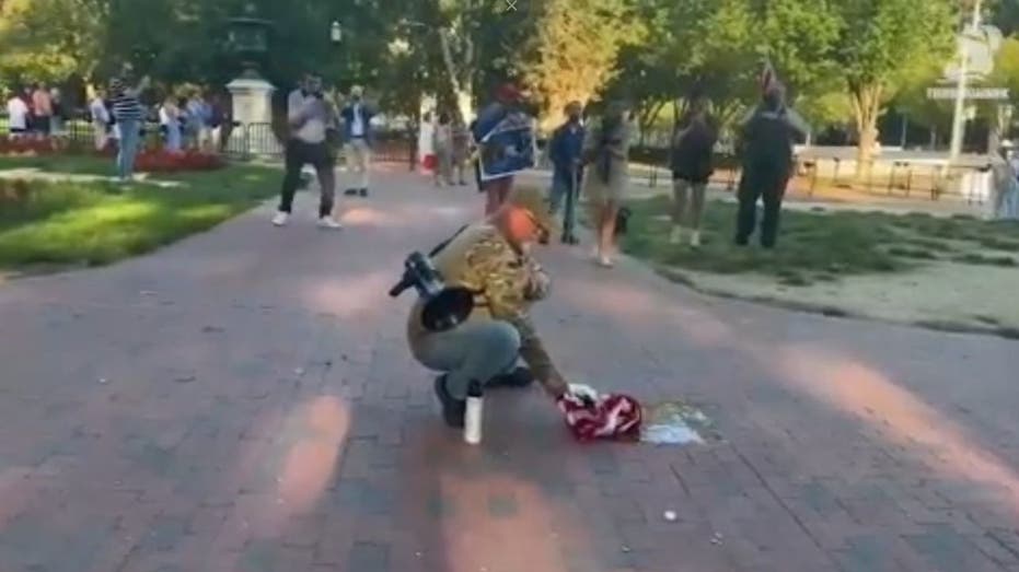 Veteran burns American flag in front of White House on day of controversial Trump executive order